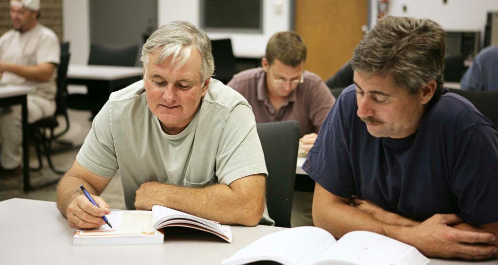 Two employees in a re-training sessions