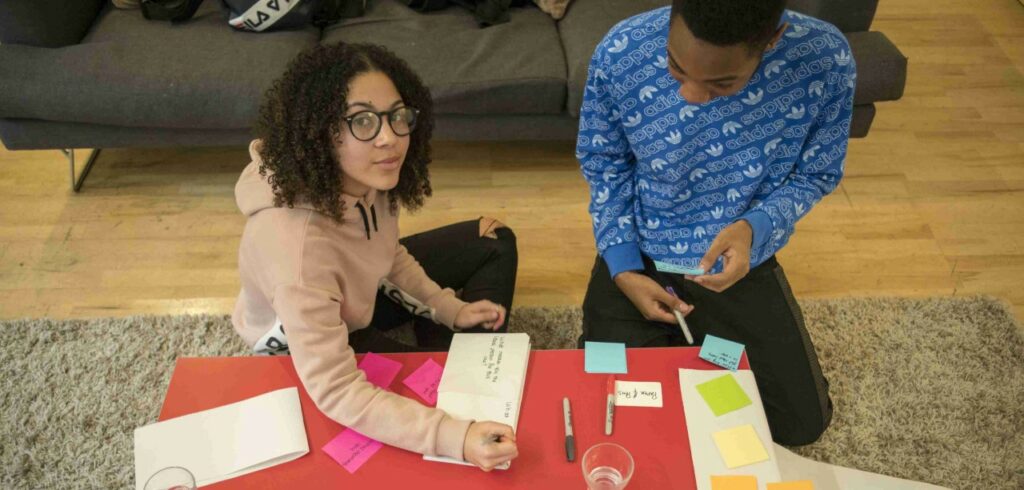 Two young people doing co-design with Create/Change